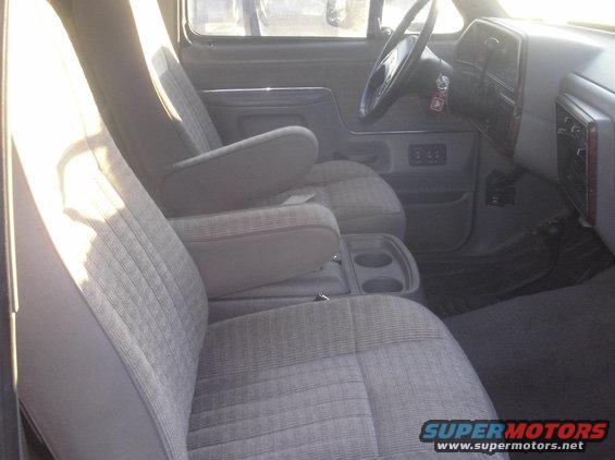 Interior of a 1988 Ford Bronco showing front seats, dashboard, and steering wheel