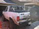 1996 Ford Bronco - This 1996 Ford Bronco is heavily modified with a rollcage and off-road tires, and appears to have been recently driven through mud.