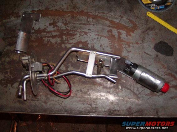 Fuel pump assembly with metal lines and red-capped end