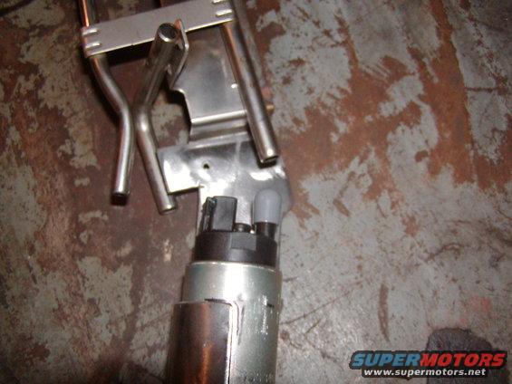 Fuel pump assembly with metal bracket and fuel lines