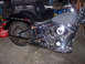 2000 Harley-Davidson Softail - A black motorcycle with chrome details is parked indoors, with a red gasoline can visible to the left.