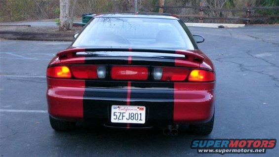 Rear view of a red car with black stripes and a spoiler. California license plate 5ZFJ801