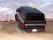 1994 Ford Bronco - A lifted Ford Bronco navigates a sandy incline under a cloudy sky.
