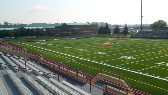 Football stadium with bleachers and field markings