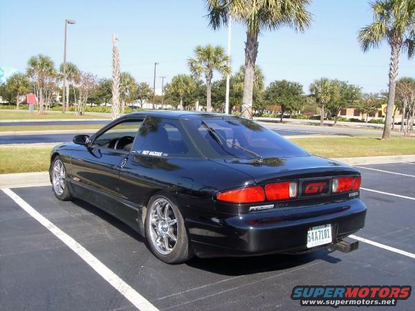 Black 1995 Ford Probe GT parked in a lot, rear view