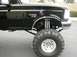 1997 Ford F-350 - Black 1997 Ford F-350 Power Stroke pickup truck with a lifted suspension and large off-road tires is shown from the front quarter angle.