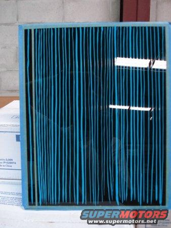 Air filter with blue and black vertical stripes, framed by a light blue border