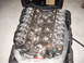 1991 Ford Mustang - A Ford V8 engine is shown inside a black carrying case, with its valve covers removed.