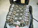 1991 Ford Mustang - A Ford V8 engine is shown with its valve covers removed, resting inside a black carrying case.
