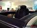 1972 Ford Ranchero - The interior of a car is shown, with other vehicles visible in the background of a showroom.