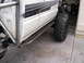 1986 Toyota Hilux - Custom rock sliders and off-road tires are installed on this pickup truck.
