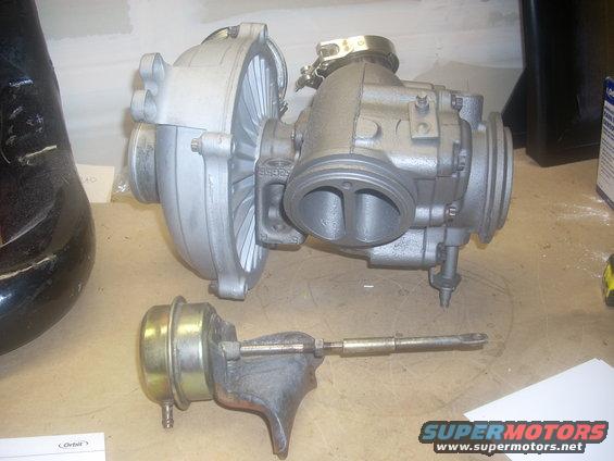 Turbocharger and wastegate assembly on a workbench