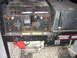 1996 Dodge 2500 - A generator with a control panel displaying various electrical outputs and a Hobbs meter is shown.