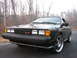 1987 Volkswagen Scirocco - Front view of a black 1987 Volkswagen Scirocco with aftermarket wheels parked outdoors.