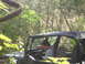 1989 Ford Bronco - Driver navigates an off-road vehicle through dense foliage and trees.