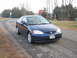 2001 Honda Civic - A blue 2001 Honda Civic coupe is parked on a dirt road next to a stop sign.