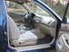2001 Honda Civic - The interior of a blue 2001 Honda Civic is visible, the dashboard, steering wheel, and front seats.