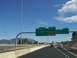 1995 Ford C-350 (Centurion Conversions) - Driving on a highway with multiple directional signs indicating different routes and destinations.