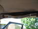 1995 Ford C-350 (Centurion Conversions) - Interior trim detail with chrome and wood-grain accents is visible above an open car door.