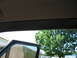 1995 Ford C-350 (Centurion Conversions) - Close-up of an interior trim piece, possibly an A-pillar molding, with visible mounting holes.