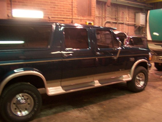 1995 Ford C-350 (Centurion Conversions) side view showing two-tone paint and running boards