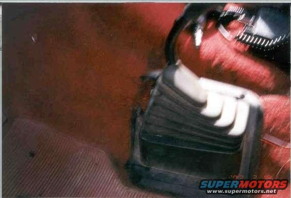 Vehicle interior with gear shifter and red upholstery