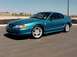 1994 Ford Mustang - A teal 1994 Ford Mustang GT coupe is viewed from a three-quarter front angle.