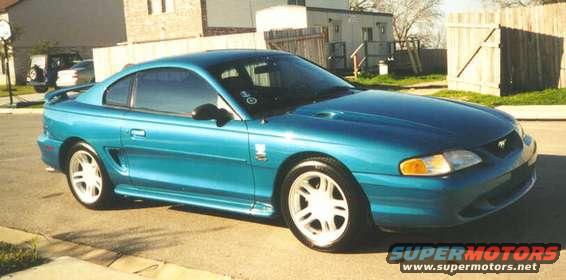 Teal 1994 Ford Mustang GT coupe parked on a street
