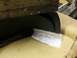1995 Ford C-350 (Centurion Conversions) - Close-up of a front valance showing a repair made with fiberglass.
