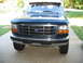 1995 Ford C-350 (Centurion Conversions) - The front of a 1995 Ford C-350 (Centurion Conversions) truck, its distinctive grille and bumper.