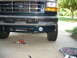 1995 Ford C-350 (Centurion Conversions) - Front view of a 1995 Ford C-350 (Centurion Conversions) showing the bumper and a newly installed fog light.
