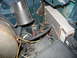 1995 Ford C-350 (Centurion Conversions) - Engine compartment wiring and components, including a horn and an electronic control module.