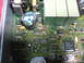 1995 Ford C-350 (Centurion Conversions) - An electronic control unit, likely from a vehicle, is shown with its intricate circuitry and components visible.