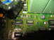 1995 Ford C-350 (Centurion Conversions) - A detailed view of electronic components on a green circuit board, including various chips and surface-mount resistors.