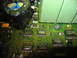 1995 Ford C-350 (Centurion Conversions) - Close-up view of a green circuit board various electronic components including capacitors and chips.