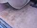 1995 Ford C-350 (Centurion Conversions) - The interior carpet shows stains and is partially covered by a spare tire cover.