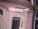 1995 Ford C-350 (Centurion Conversions) - Close-up of a worn vehicle interior panel with visible vents and dark marks.