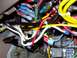 1995 Ford C-350 (Centurion Conversions) - A tangle of wires and electrical components, likely part of a vehicle's interior wiring system.