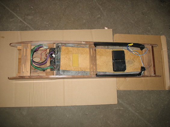 Overhead console interior with exposed wiring and black electronic components