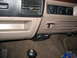 1995 Ford C-350 (Centurion Conversions) - Interior view of dashboard and trailer brake controller installation.