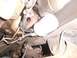 1995 Ford C-350 (Centurion Conversions) - Underside view of a transmission fluid filter and associated hoses.