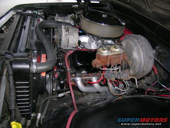 Engine bay with V8 engine, chrome air cleaner, and brake booster