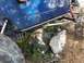 1989 Ford Bronco - This modified Jeep Wrangler is shown off-roading over large rocks.
