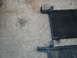 1995 Ford C-350 (Centurion Conversions) - Two car AC condensers are shown resting on a concrete surface, likely removed for repair or replacement.