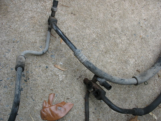 AC hoses and fittings on concrete