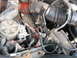 1995 Ford C-350 (Centurion Conversions) - Engine bay details showing various hoses, wiring harnesses, and mechanical components.