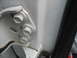 1995 Ford C-350 (Centurion Conversions) - Close-up view of the door hinge bolts, likely for adjustment purposes.