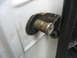 1995 Ford C-350 (Centurion Conversions) - Door hinge pin showing rust and wear on a white vehicle.