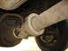 1995 Ford C-350 (Centurion Conversions) - Underside view of a vehicle's drivetrain components, focusing on the driveshaft and rear differential.