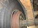 1995 Ford C-350 (Centurion Conversions) - The rear axle, leaf spring, and drum brake assembly show significant rust.